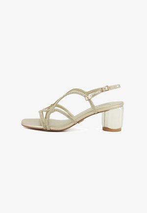 Sandalo beige con punta aperta, tacco a blocco, sottili cinturini ornati con strass e fibbia regolabile alla caviglia.