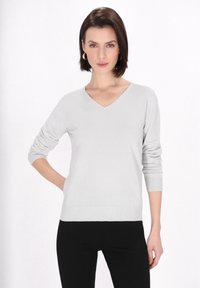 Helle graue V-Ausschnitt-Strickjacke mit langen Ärmeln, aus weichem Strickstoff gefertigt. Bietet ein tailliertes Design sowie gerippte Bündchen und Saum.