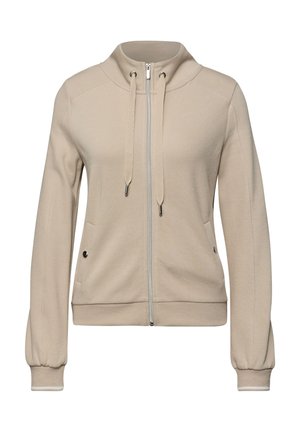 Beżowa kurtka na zamek z kapturem ze ściągaczem, długimi rękawami, dwoma bocznymi kieszeniami z zatrzaskami oraz ściągaczami na mankietach i na dole.