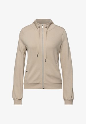 Veste beige zippée avec capuche réglable par cordon, manches longues, deux poches latérales avec détails à boutons, poignets et ourlet côtelés.