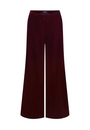 Pantalons larges en velours bourgogne profond, présentant une texture douce et une coupe décontractée, avec une taille élastique et sans fermetures visibles.