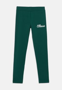 Vihreät legginsit, jotka on valmistettu pehmeästä kankaasta ja joissa on tiukka malli. Etuosassa vasemmalla on brodeerattu "Ellesse"-logo. Liuha rakenne.