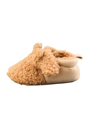 Soft, beige baby shoe with curly plush fabric and small floppy ears resembling a puppy, designed for comfort and warmth.