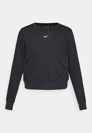 Schwarzes, kurzes Sweatshirt mit langen Ärmeln, gerippten Bündchen und Saum, das ein kleines, zentriertes weißes Nike-Logo auf der Brust zeigt. Weicher Stoff.