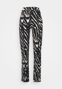 Svarta och krämfärgade zebramönstrade byxor med en åtsittande midja, raka ben, texturerad tyg och synliga kontrasterande mönster över hela.