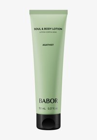 Babor Soul & Body Lotion w jasnozielonej tubie z czarnymi akcentami, 150 ml. Charakteryzuje się eleganckim designem, wyraźnym oznakowaniem i zakrętką na flip-top.