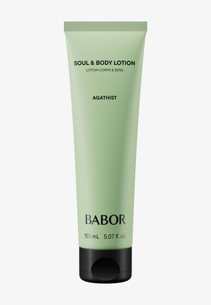 Lotion Babor Soul & Body dans un tube vert clair avec des accents noirs, 150 mL. Présente un design épuré, une étiquette claire et un bouchon à clapet.