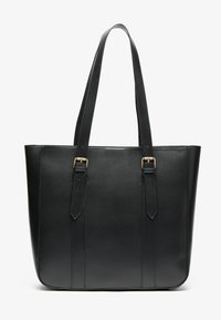 Black leather tote bag with dual straps, rectangular shape, smooth texture, and gold-tone hardware accents. Features vertical seam detailing.