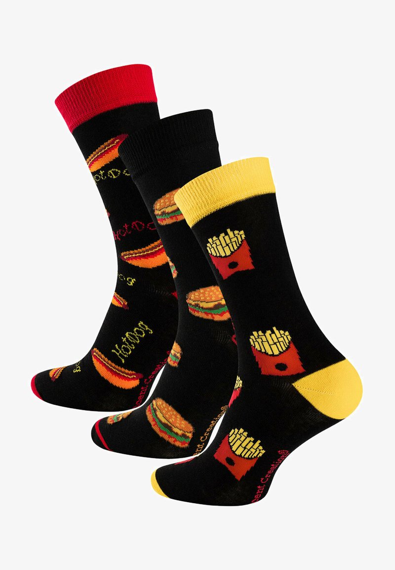 Black socks featuring food-themed designs: red hot dogs, yellow fries, and burgers. Accented with red, yellow tops, and various printed patterns.