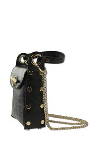 Black leather handbag with gold hardware, featuring a chain strap, studded accents, and a decorative bee emblem on the flap closure.