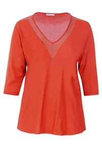 V-hals top met driekwart mouwen in levendig oranje. Gemaakt van zacht materiaal met een subtiele glans langs de halslijn. Casual, relaxte pasvorm.