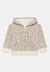 Felpa con zip a motivo floreale in crema con accenti gialli, rosa e verdi. Presenta il logo "GAP" davanti e un interno morbido e strutturato.