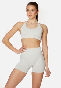 EVE SEAMLESS HALTER  - Sportovní podprsenky se střední oporou - beige