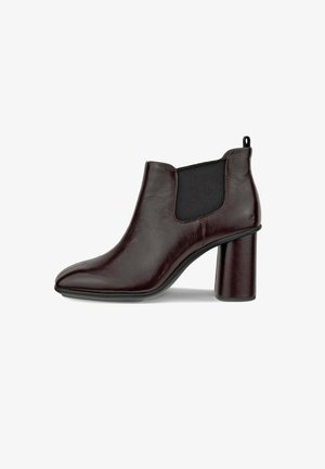 Burgunderfarbene Leder-Ankle-Boots mit spitzem Zehenbereich und massivem schwarzen Absatz. Verfügt über seitliche elastische Einsätze und eine Zuglasche für einfaches An- und Ausziehen.