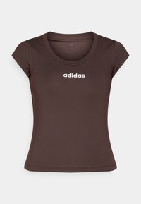 Brown fitted t-shirt made of elastic material, featuring a ribbed round neckline and short sleeves, with "adidas" logo in white.