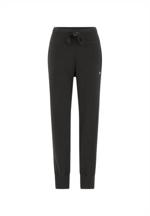 Pantalones de chándal negros hechos de una tela suave, con una cintura ajustable con cordón, puños acanalados y un pequeño logo en el lado.