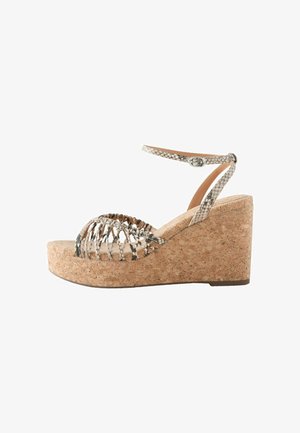 Wedge sandal with a cork platform, featuring a snakeskin-patterned upper and an ankle strap with a buckle. Open-toe design.