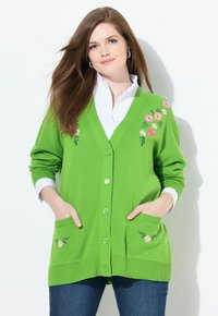 Grön cardigan med blommig broderi i rosa och vitt, med V-ringning, knäppning och fickor. Ribbad mudd och nederkant.