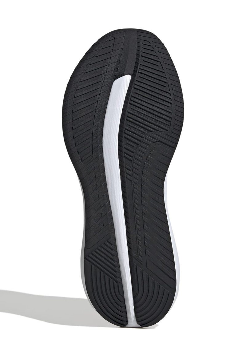 Suela de zapato de goma negra con un patrón de tracción distintivo, que presenta una franja blanca en la entresuela y bordes redondeados para flexibilidad y agarre.