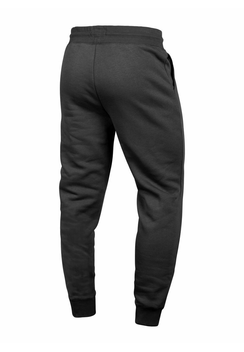 Gray sweatpants with a smooth texture, elastic waistband, side pockets, and fitted cuffs at the ankles. Minimalist design, no visible patterns.