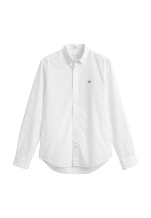Wit overhemd met lange mouwen, knopen aan de voorkant, een kraag en een klein geborduurd logo op de linkerborst.