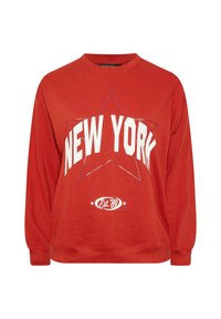 Felpa rossa con la scritta "NEW YORK" in bianco, grande grafica di stella e logo "Est. '89". Realizzata in tessuto morbido con una vestibilità comoda.