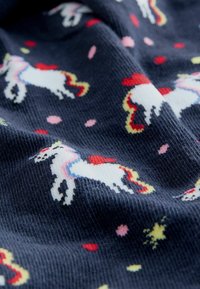 Navy blue fabric with a textured surface, featuring a repeating pattern of unicorns in white, red, and pink, with small colorful accents.