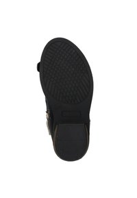 Zwarte rubberen buitenzool met een textuurpatroon voor grip, met een ronde teen en een lichte hak. Zijritsaccent in een contrasterende kleur.