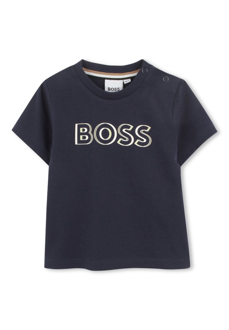 Navy blue short-sleeve T-shirt made of cotton, featuring a large "BOSS" logo in cream. Includes snap fasteners on the shoulder.