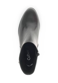 Schwarze Leder-Ankle-Boots mit runder Zehenpartie, Reißverschluss und weicher Innenauskleidung. Glatte Textur mit subtiler Markenkennzeichnung auf der Innensohle.