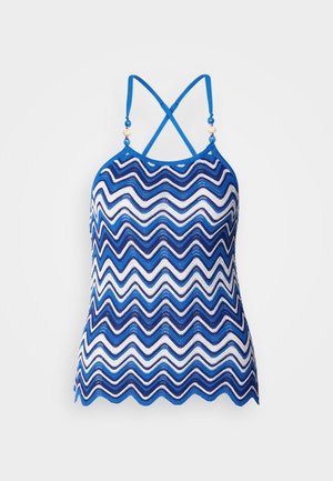 Blå og hvit zigzag-mønstrete halterneck-top med justerbare kryssende stropper og dekorative perle detaljer ved utringningen. Pustende heklet materiale.