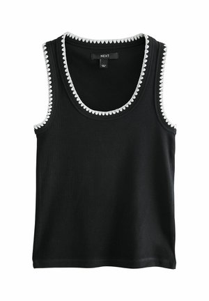 Haut noir sans manches côtelé avec bordure blanche festonnée le long de l'encolure et des emmanchures, fabriqué en tissu doux.