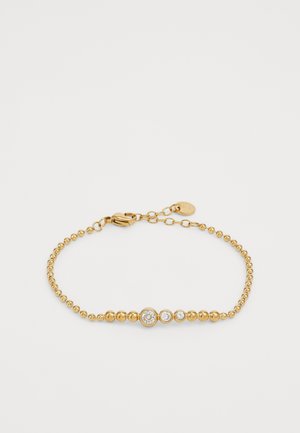 Gold bracelet featuring smooth spherical beads, three circular clear stone accents, and a secure clasp with an adjustable chain.