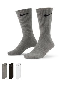Calcetines de crew de mezcla de algodón gris con textura acanalada, que presentan un swoosh negro de Nike. El juego incluye variaciones de calcetines en negro, gris y blanco.