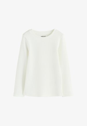 Pitkähihainen, valkoinen ribbipaita, jossa on pyöreä kaula-aukko ja suora helma. Valmistettu pehmeästä kankaasta, jossa on hienovaraista pintatekstuuria ja ei näkyviä koristeita.