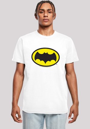 White cotton t-shirt featuring a large black and yellow Batman logo in an oval shape, crew neck, and short sleeves.
