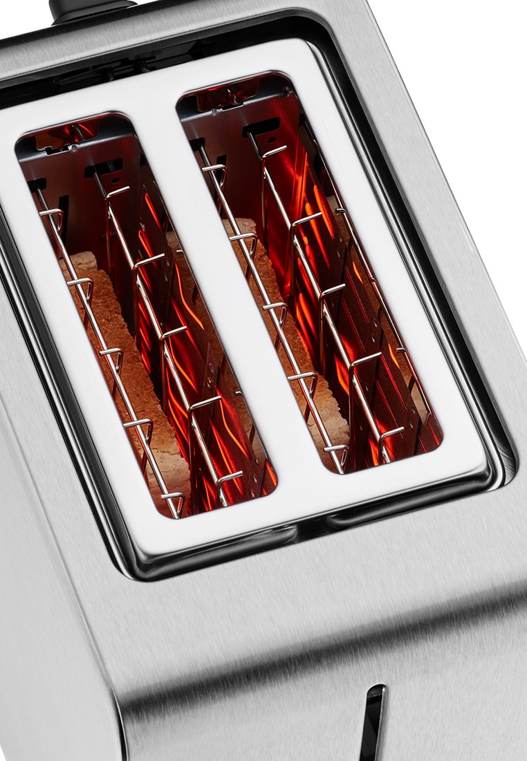 Grille-pain en acier inoxydable à deux fentes, doté d'éléments chauffants rouges, de grilles de toast en fil métallique et d'un design moderne et épuré.
