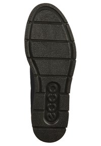 Semelle de chaussure en caoutchouc noir avec un motif de nervures texturé, présentant un avant arrondi, des rainures pour l'adhérence, et un logo proéminent embossé au centre.