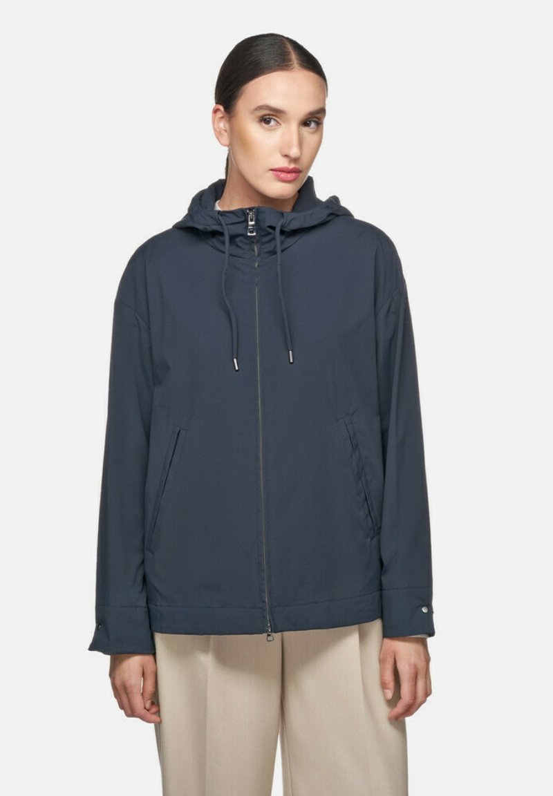 Donkerblauwe lichtgewicht jas met een capuchon, ritssluitingen, verstelbare koordjes en zijzakken. Glad textuur en een casual ontwerp.