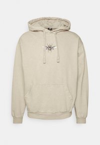 Beige mikina s kapucí, která má přední kapsu, vroubkované manžety a centrální vyšité design s včelou. Měkká textilie.