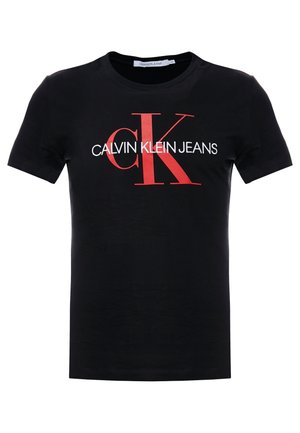 Zwart T-shirt met korte mouwen en een groot rood "cK"-logo en witte tekst "CALVIN KLEIN JEANS" gecentreerd op de voorkant.