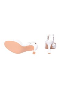 Sandali con tacco bianco dal design elegante. Presentano un tacco sottile, una cinghia alla caviglia regolabile e una superficie liscia. Suola color beige chiaro.