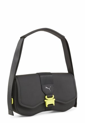 Sac bandoulière synthétique noir avec fermeture à rabat, comportant une boucle d'accent jaune, une sangle réglable et un logo discret sur le devant.