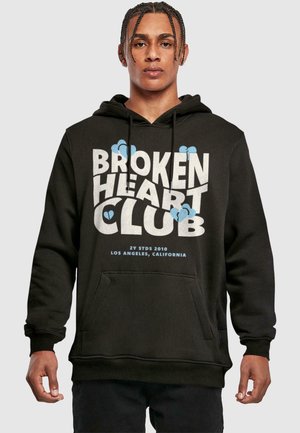 Black hoodie featuring a large, bold "BROKEN HEART CLUB" graphic in white and light blue, with a front pocket and drawstring hood.