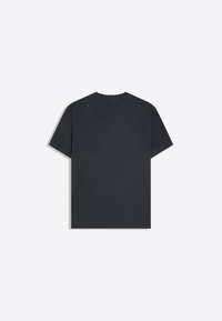 T-shirt noir uni à manches courtes en coton, vu de dos, avec un col rond, sur un fond neutre.