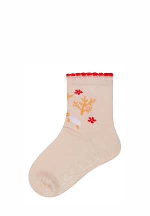 Beige Socken mit rotem, gewelltem Bund. Mit weißen Rentieren und gelben Geweihen, verziert mit roten Blumen. Weiches, dehnbares Material.