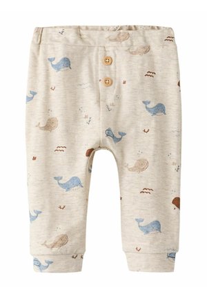 Beige Babyhosen mit blauen und braunen Wal-Mustern und zwei Holzknöpfen am vorderen Bund.