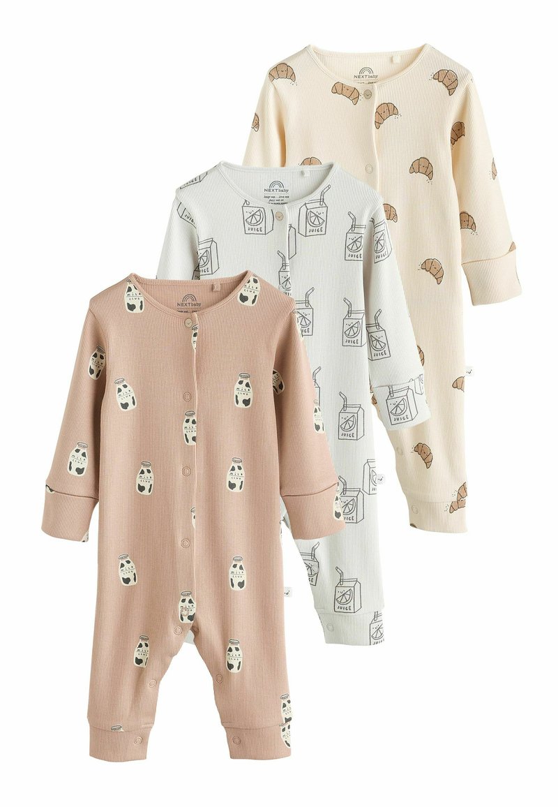 Tre baby bodysuits i mjuk bomull: en rosa med tryck av nappflaskor, en vit med teckningar av juice och en krämfärgad med croissantmotiv.