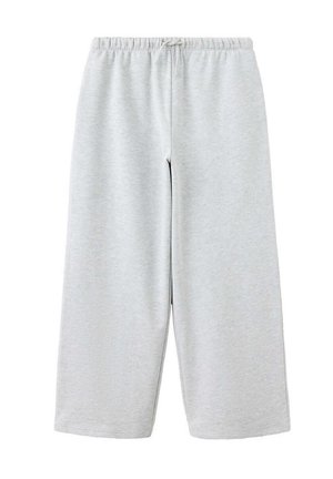 Lichtgrijze sweatpants met wijde pijpen, elastische tailleband en trekkoord, gemaakt van zachte stof.