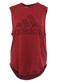 Punainen hihaton urheilupaita, joka on valmistettu kevyestä kankaasta. Edessä on suuri musta Adidas-logo ja pyöristetty helma.